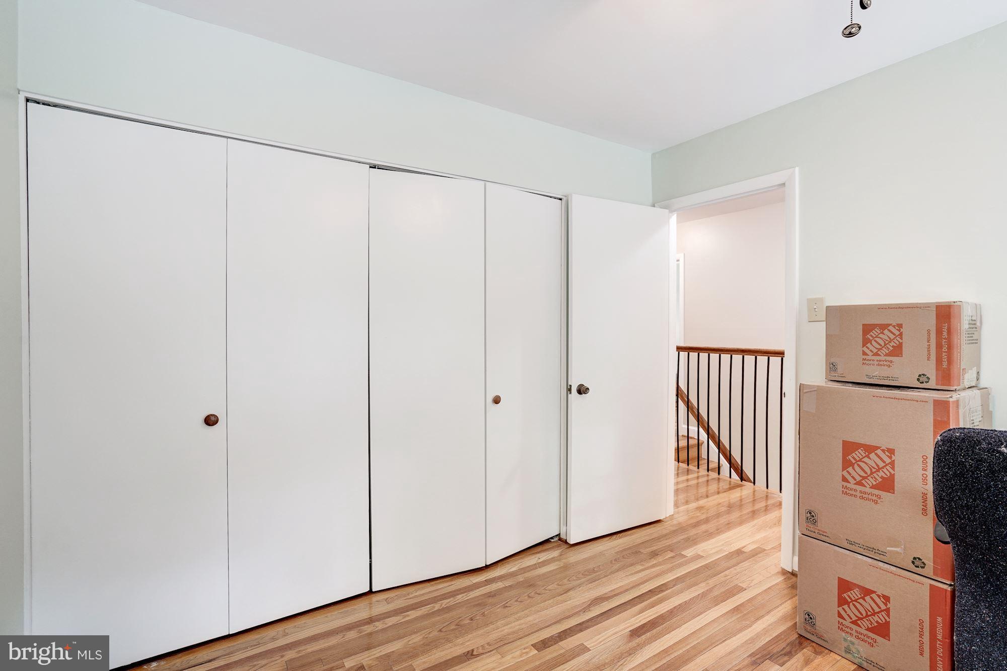 11089 Saffold Way Reston, VA 20190 - Photo 21 of 30 a view of a hallway with wooden floor and cabinet
