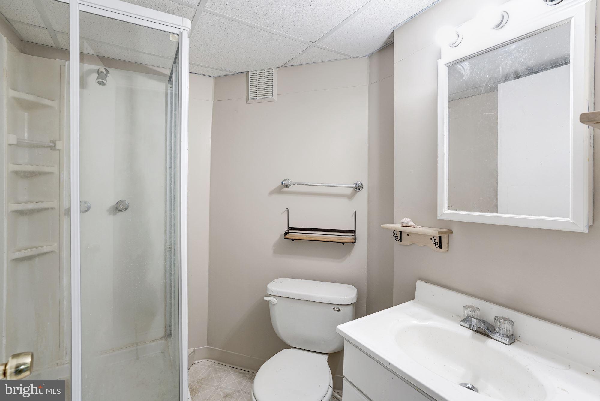 11089 Saffold Way Reston, VA 20190 - Photo 22 of 30 a bathroom with a toilet sink and a mirror