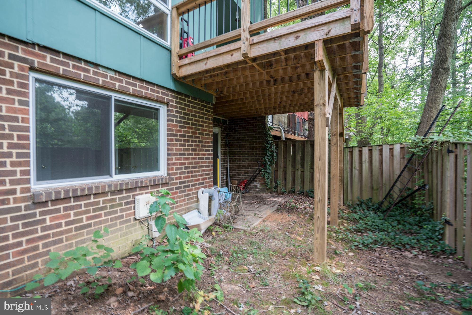 11089 Saffold Way Reston, VA 20190 - Photo 27 of 30 a front view of a house with garden