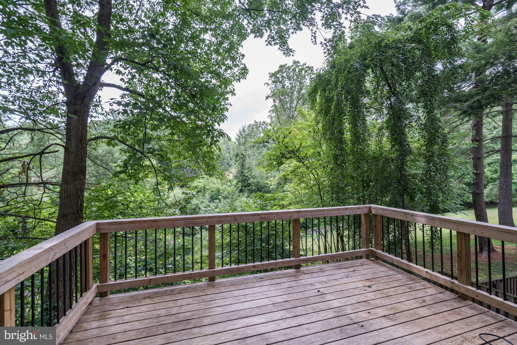 11089 Saffold Way Reston, VA 20190 - Photo 28 of 30 a view of balcony with wooden floor and fence