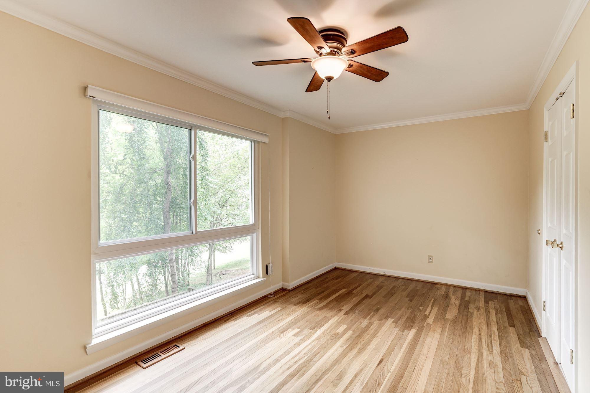 11089 Saffold Way Reston, VA 20190 - Photo 7 of 30 wooden floor in an empty room with a window