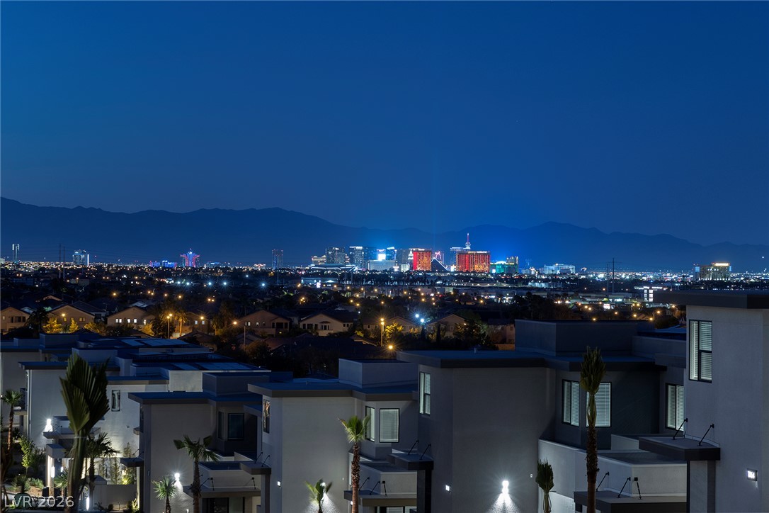 11027 Socrates Ridge Street Las Vegas, NV 89141 - Photo 16 of 20 Dramatic cityscape views shimmer against the distant mountain range from this modern community.