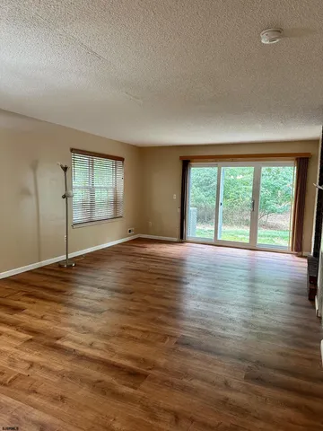 wooden floor in an empty room with window