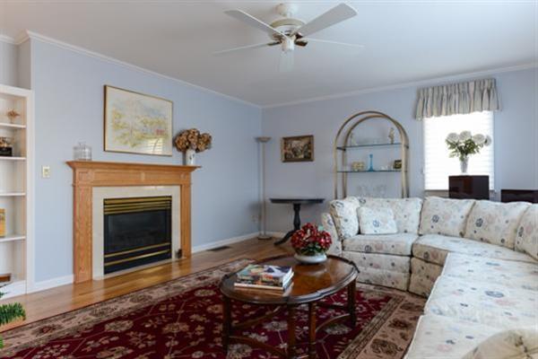 115 Fells Pond Road Mashpee, MA 02649 - Photo 8 of 17 a living room with furniture and a fireplace