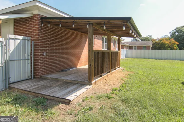 a view of a field with a tree