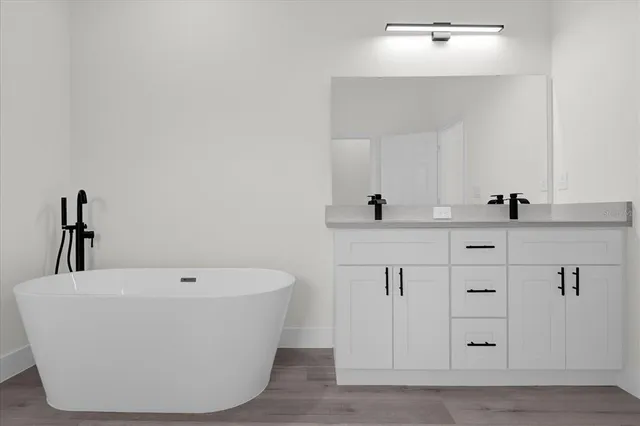 a white bath tub sitting in a bathroom