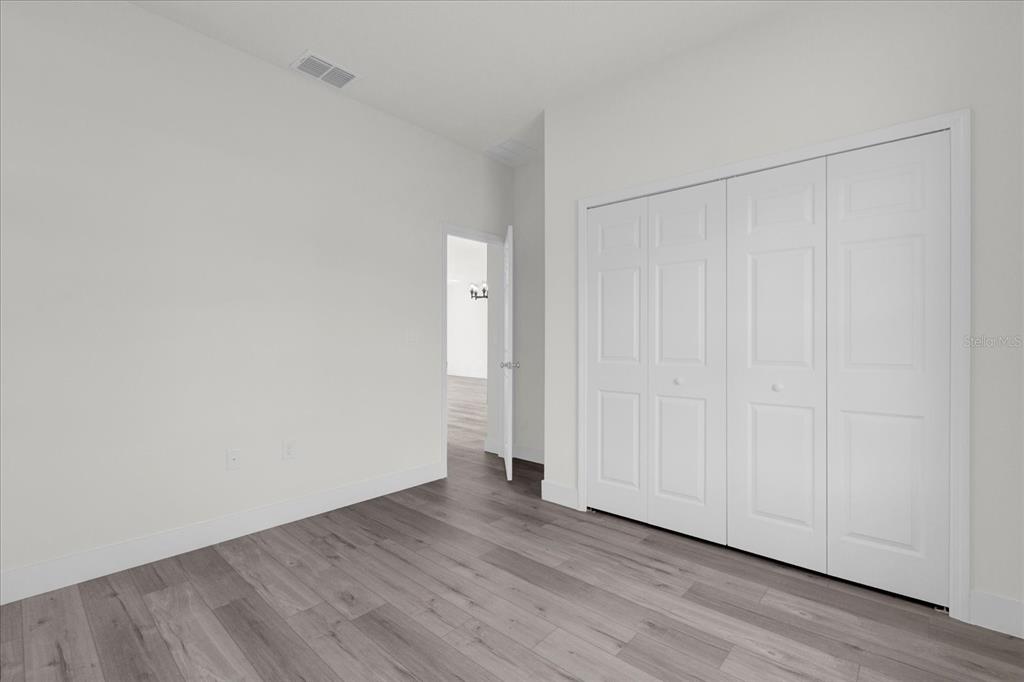 2396 Southwest 147th Lane Road Ocala, FL 34473 - Photo 19 of 32 a view of an empty room and wooden floor