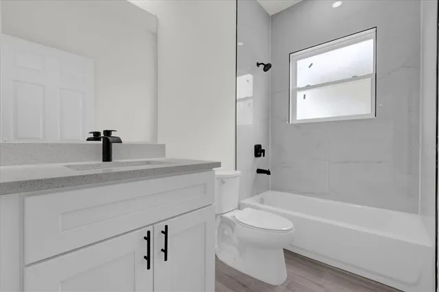 a bathroom with a sink a toilet and a bathtub