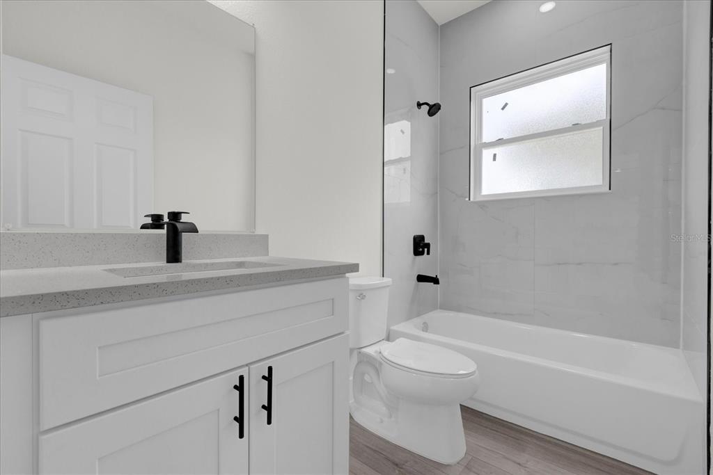 2396 Southwest 147th Lane Road Ocala, FL 34473 - Photo 20 of 32 a bathroom with a sink a toilet and a bathtub