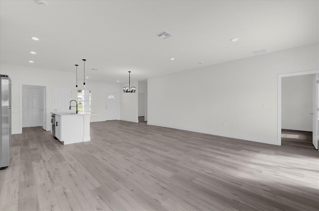 2396 Southwest 147th Lane Road Ocala, FL 34473 - Photo 9 of 32 a view of a kitchen with a sink and a refrigerator
