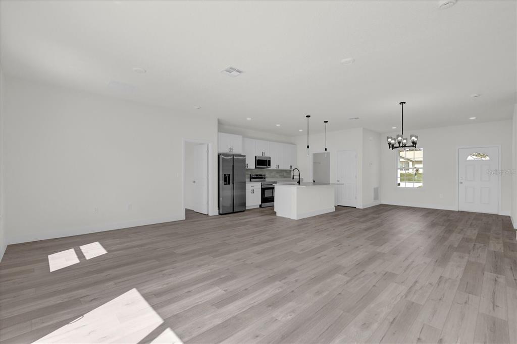 2396 Southwest 147th Lane Road Ocala, FL 34473 - Photo 10 of 32 a view of empty room with wooden floor