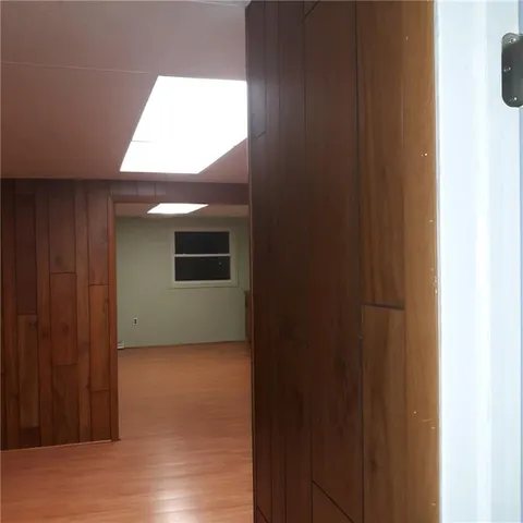 a view of an empty room and wooden floor