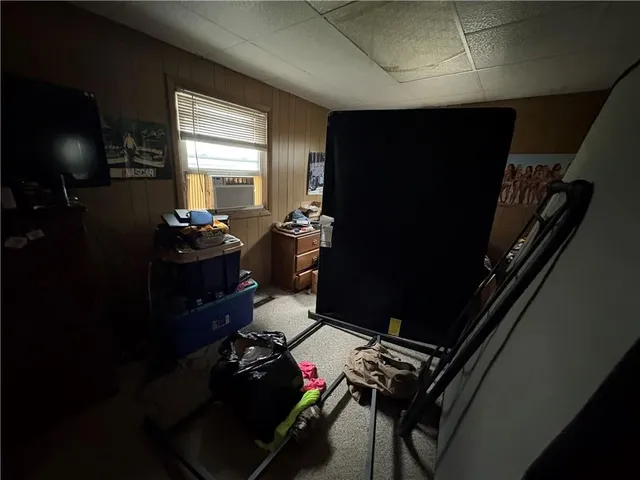 a room with furniture and flat screen tv