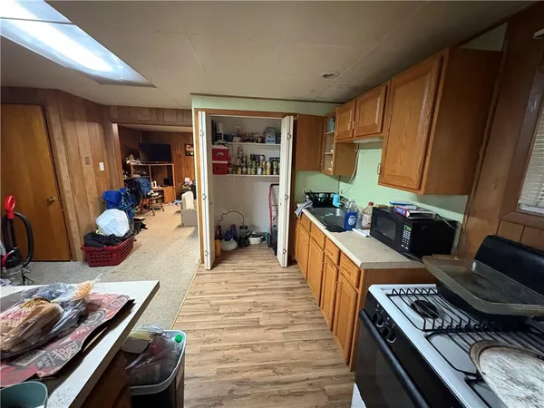 a kitchen with a stove and a refrigerator