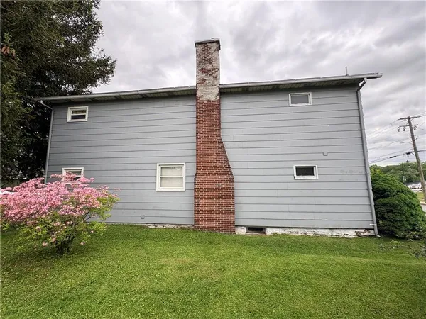 a front view of house with yard