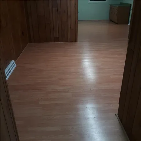a view of room and wooden floor