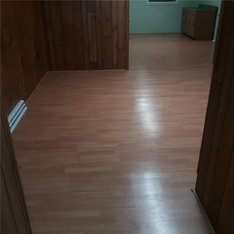 a view of room and wooden floor