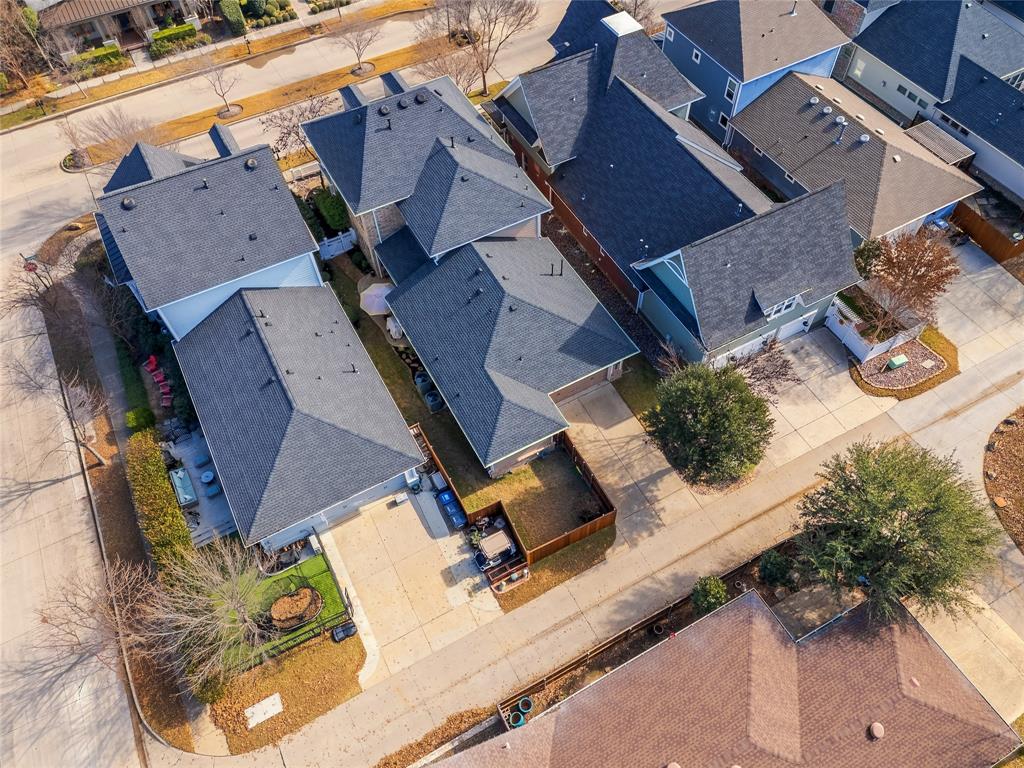 2205 State Boulevard McKinney, TX 75071 - Photo 28 of 40 Aerial view of residential area showing the expanded backyard grass area behind the house.This is now connected to the backyard.