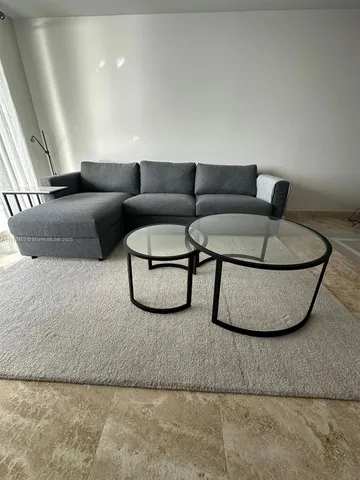 a living room with furniture and a couch