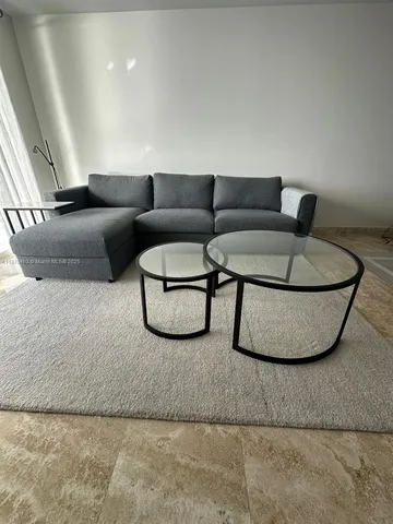 a living room with furniture and a couch