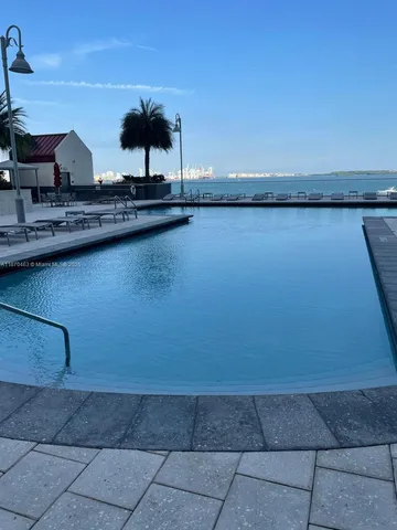 a kitchen with a sink cabinets and utility