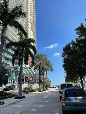 a view of street with parked cars