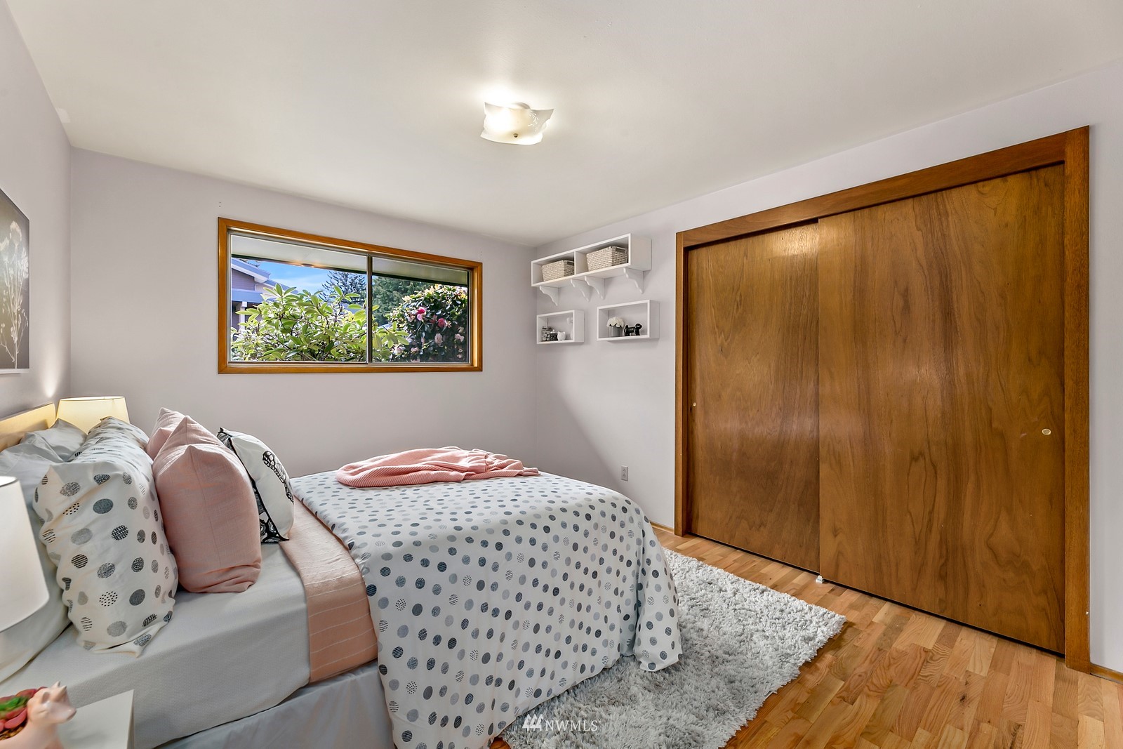 309 Powell Avenue Southwest Renton, WA 98057 - Photo 14 of 29 a bedroom with a bed and a painting on the wall