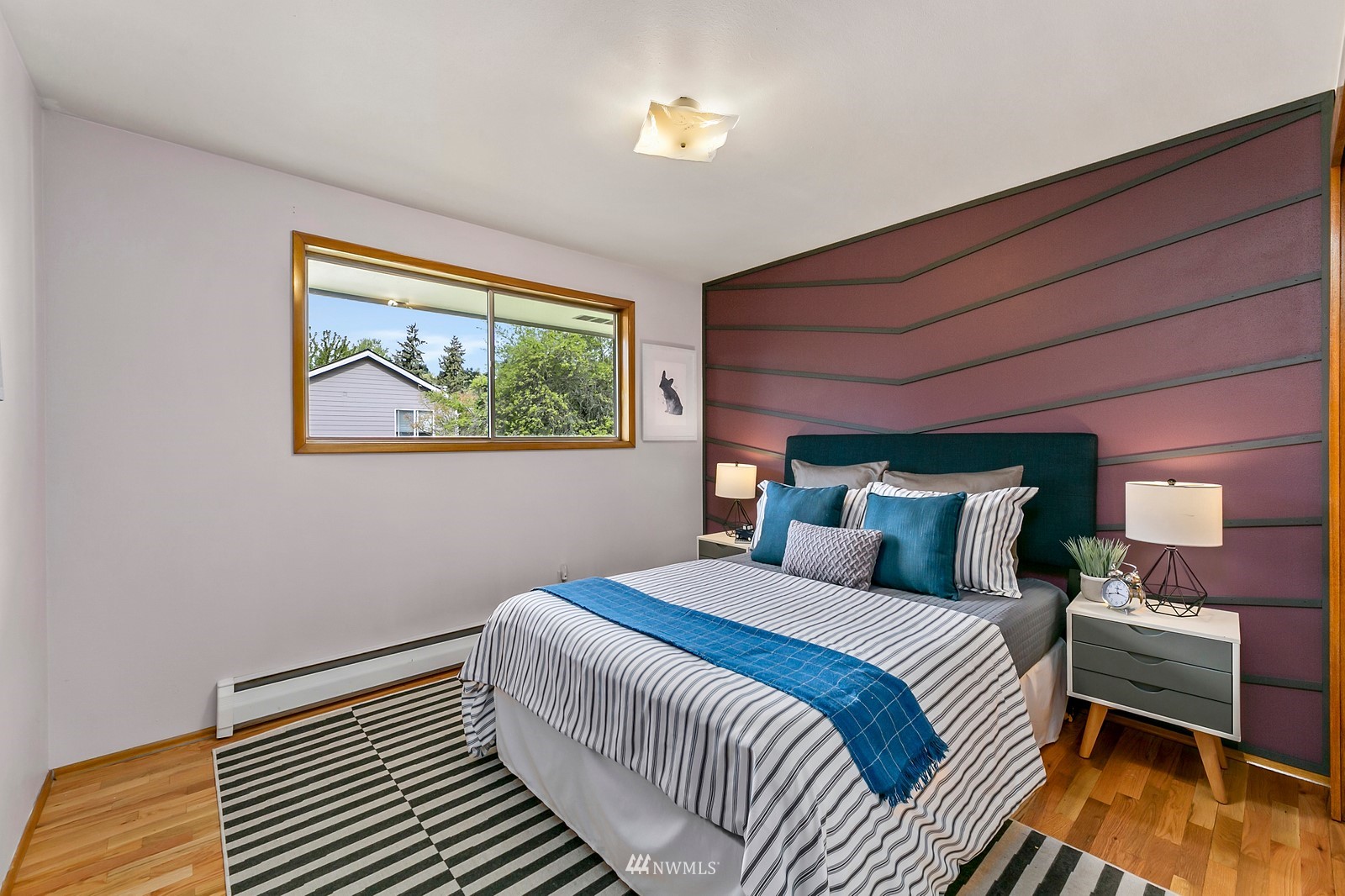 309 Powell Avenue Southwest Renton, WA 98057 - Photo 16 of 29 a bedroom with double bed and a window