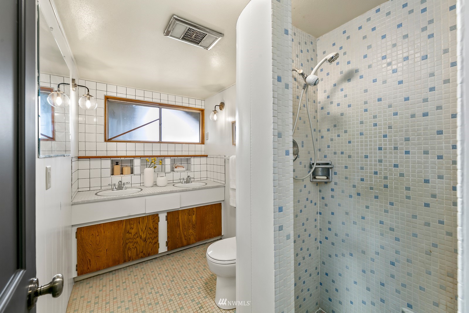 309 Powell Avenue Southwest Renton, WA 98057 - Photo 23 of 29 a bathroom with a toilet a sink and a mirror