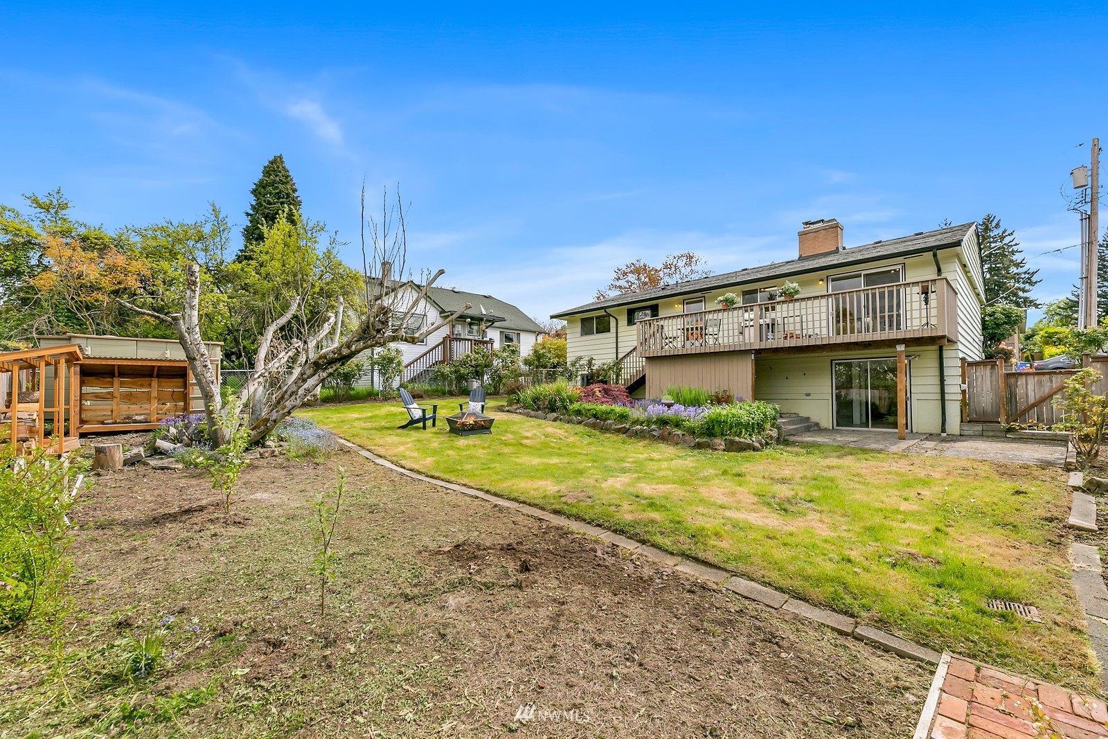 309 Powell Avenue Southwest Renton, WA 98057 - Photo 25 of 29 a view of a house with a yard