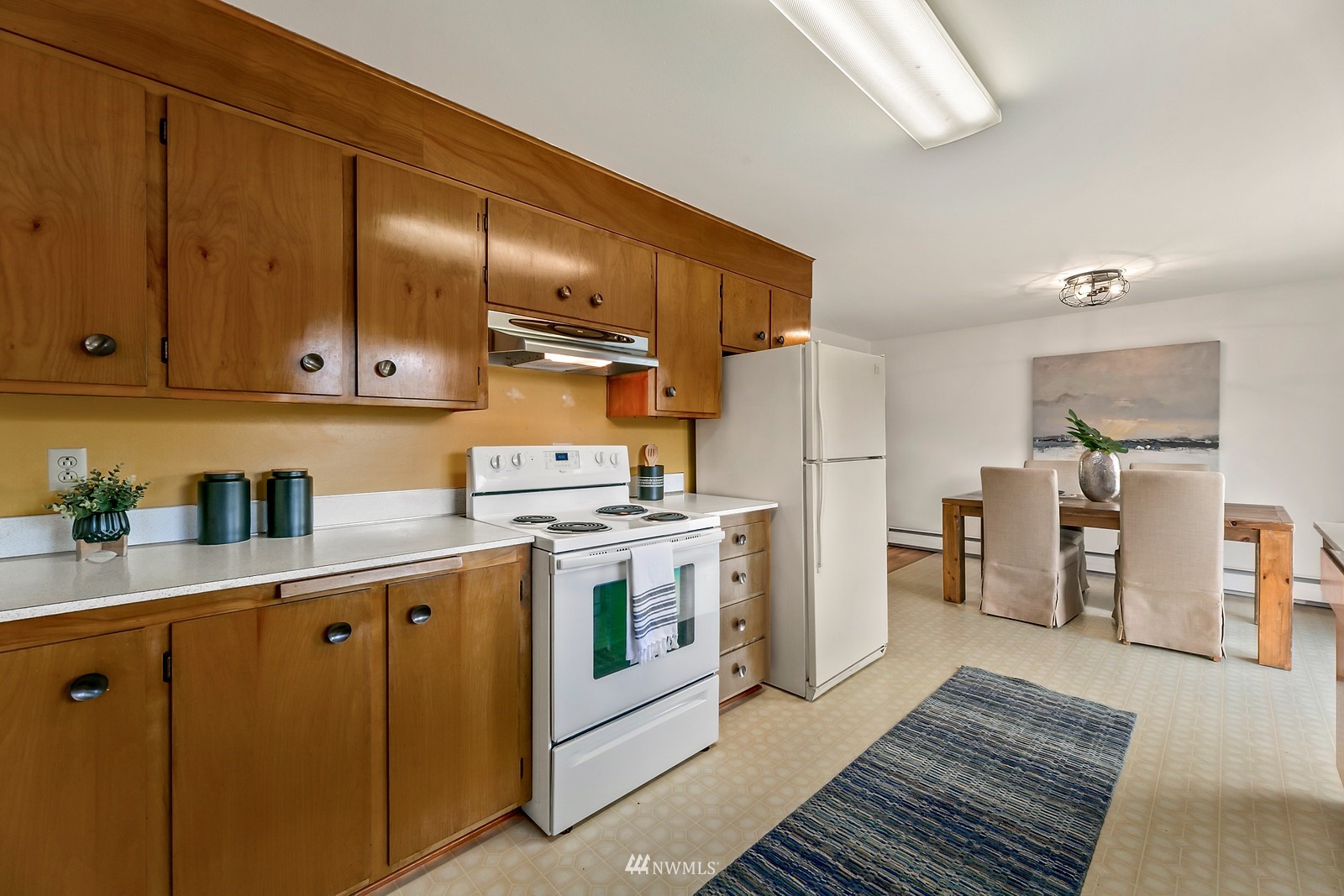309 Powell Avenue Southwest Renton, WA 98057 - Photo 6 of 29 a kitchen with stainless steel appliances granite countertop a sink stove and refrigerator