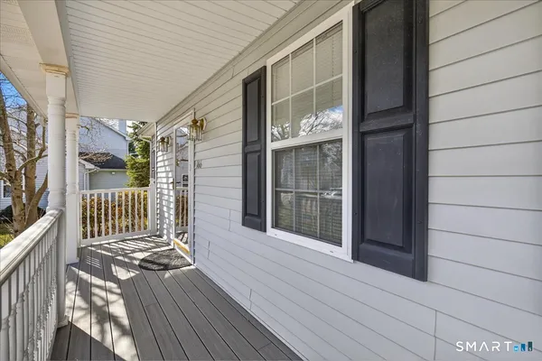 a view of a balcony with wooden floor