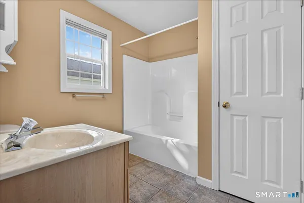 a bathroom with a sink and tub