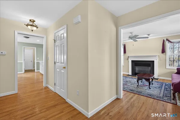 a view of a livingroom with furniture and wooden floor