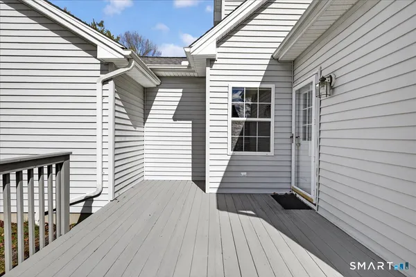 a view of a house with wooden deck