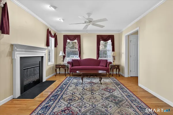 a living room with a couch and a fireplace