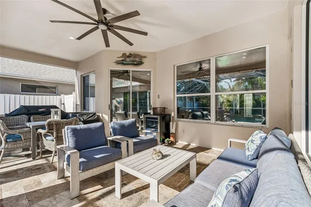 a kitchen with stainless steel appliances granite countertop a sink a stove and a refrigerator