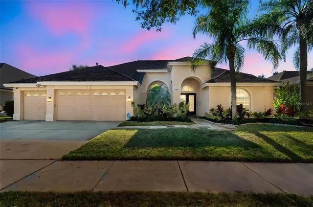 a view of a backyard with sitting area