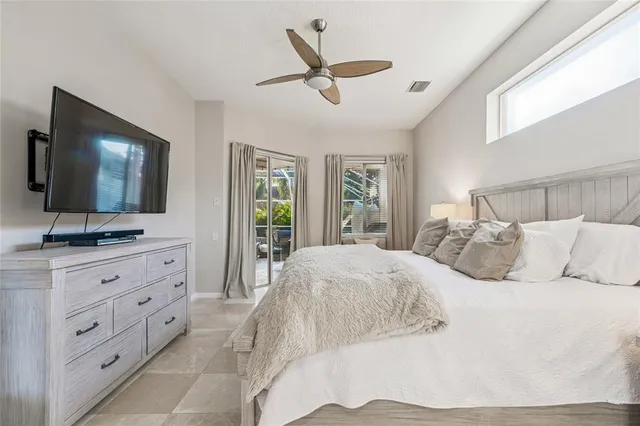 an aerial view of a house with swimming pool and patio