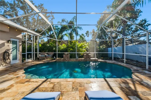 a bedroom with a large bed and a flat screen tv