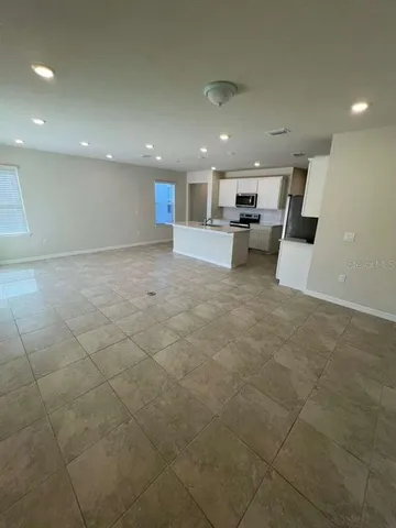 a view of a kitchen with a sink and a stove top oven