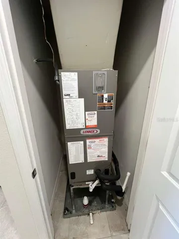 a view of an empty room with kitchen