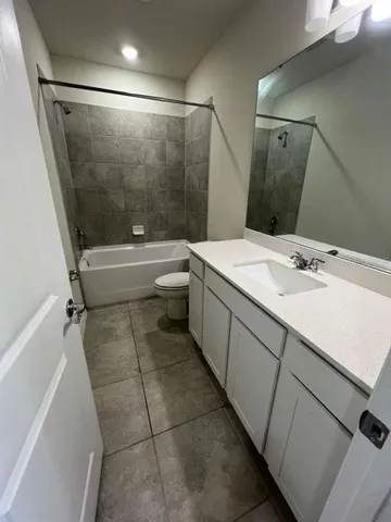 a bathroom with a toilet and a sink