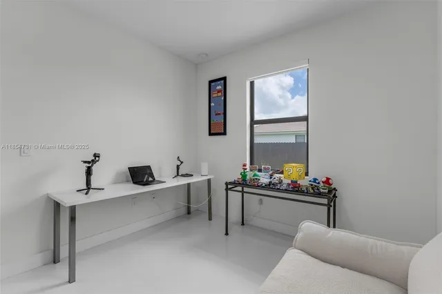 a living room with furniture and window