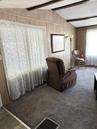 a kitchen with kitchen island a counter top space a sink stainless steel appliances and cabinets