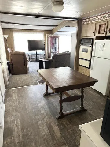 a bathroom with a toilet a sink and a mirror