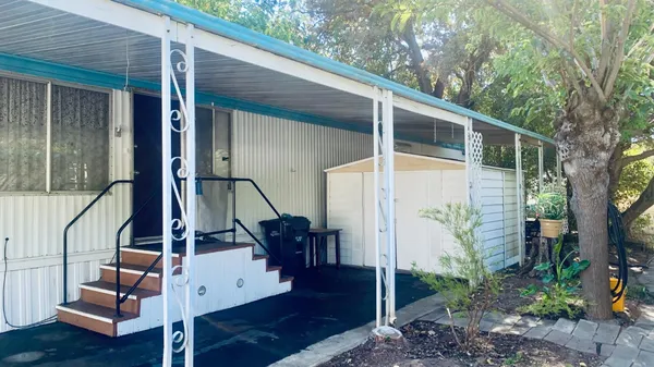 a view of staircase with white walls and a window