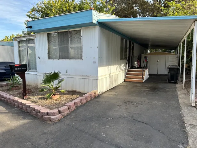 a vase of flowers sitting on a floor
