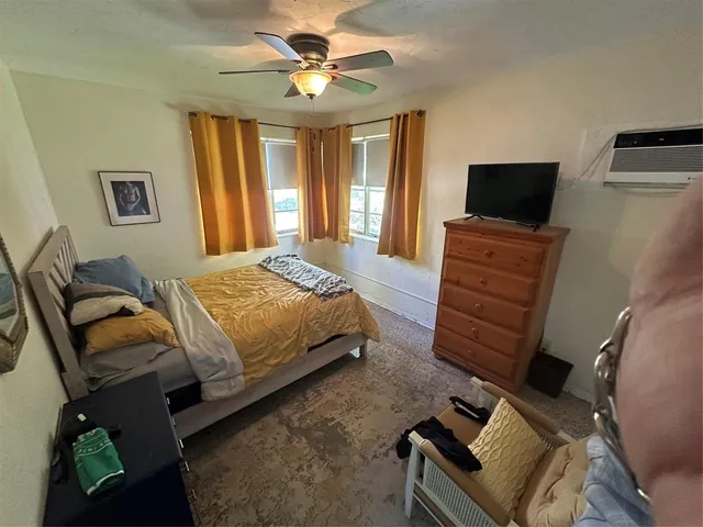 a bedroom with a bed and furniture