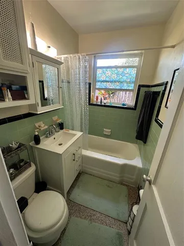 a bathroom with a sink a toilet and a bathtub